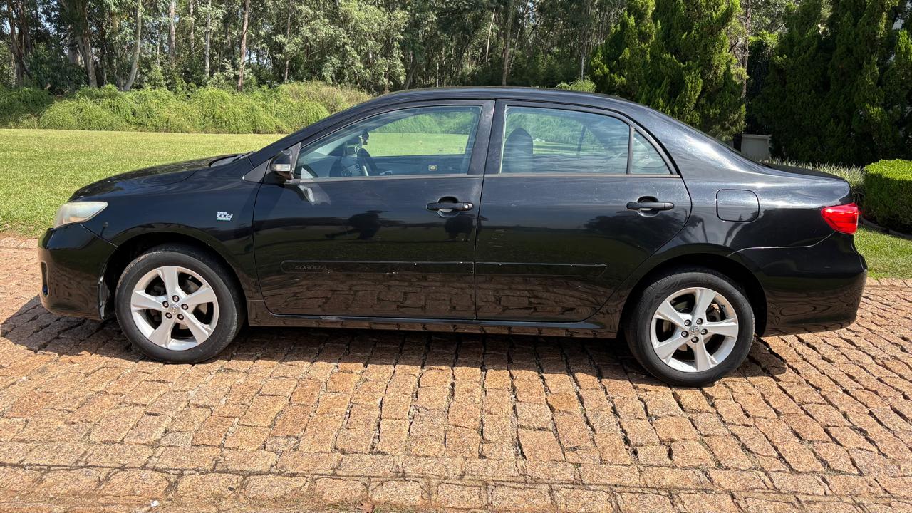 TOYOTA  COROLLA XEI - Foto 8